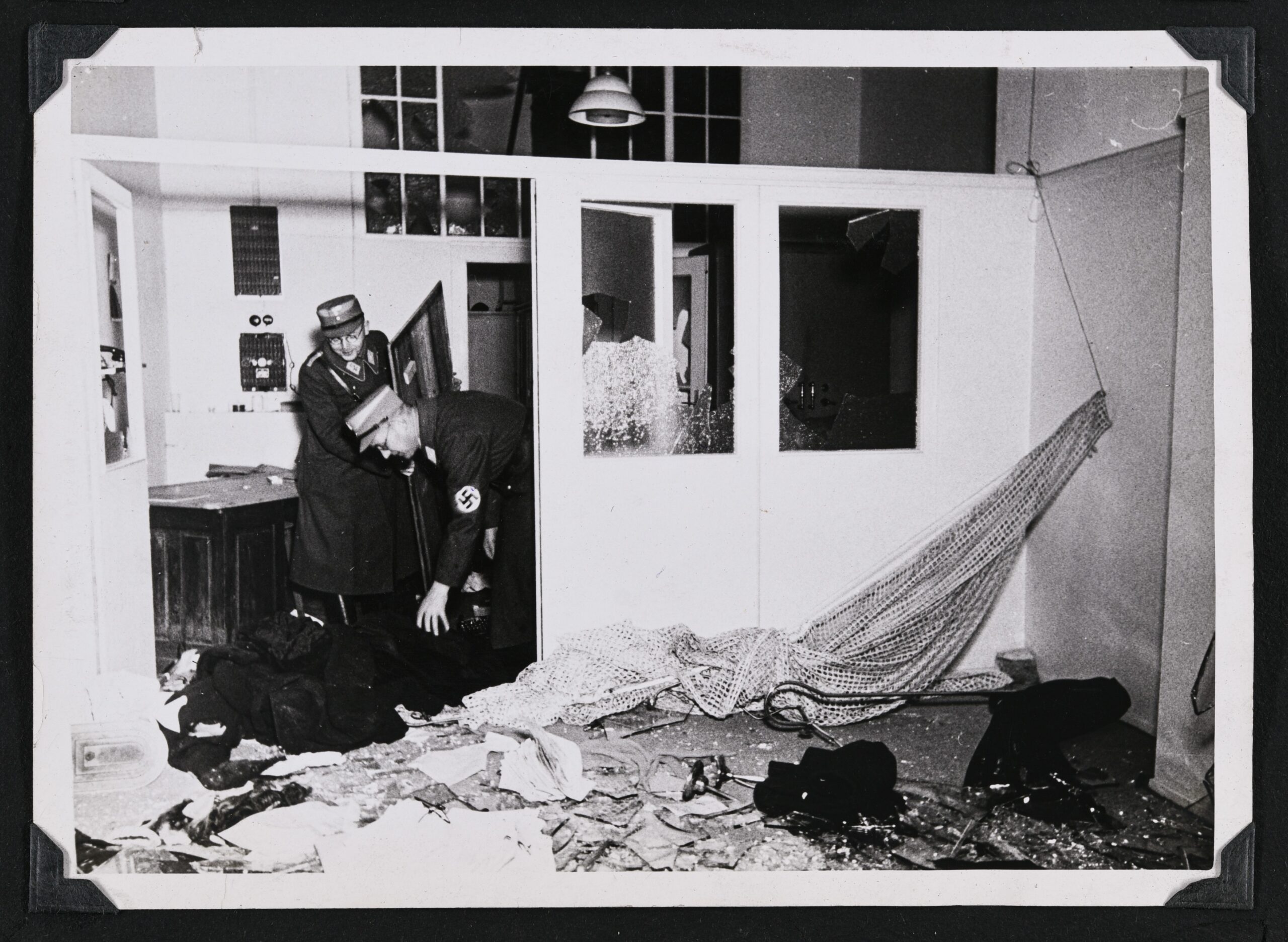 SS soldiers looting and destroying a Jewish residence during the Kristallnacht riots, 10/11/1938, Fuerth, Germany